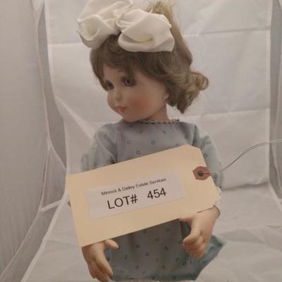 Lot 454. girl doll M.L.A 1999