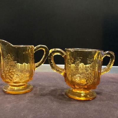 VINTAGE LG WRIGHT AMBER GLASS FOOTED CREAMER/SUGAR EMBOSSED GRAPES