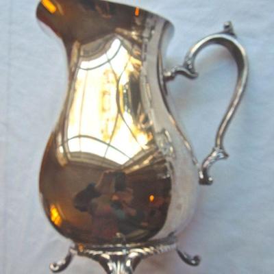 Lot 173: Four Heavy Monogramed Beer Mugs and a Silver Pitcher