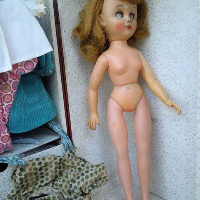 Lot 230: 1960's Metal Doll Case, Doll and Homemade Doll Clothes