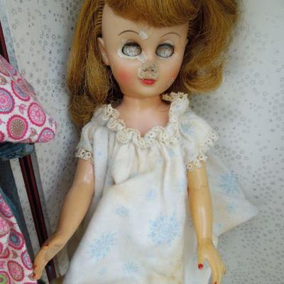 Lot 230: 1960's Metal Doll Case, Doll and Homemade Doll Clothes