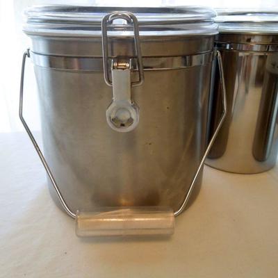 Lot 184: 5 Stainless Canisters and Stainless Towel Dispenser