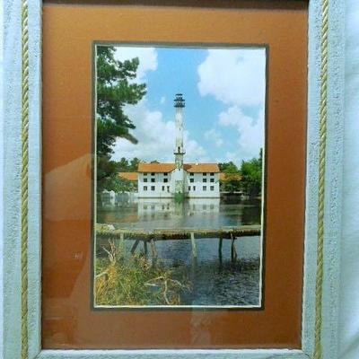Lot 21: Two Lighthouse Framed Photographs, Brass Sailboat and Shells
