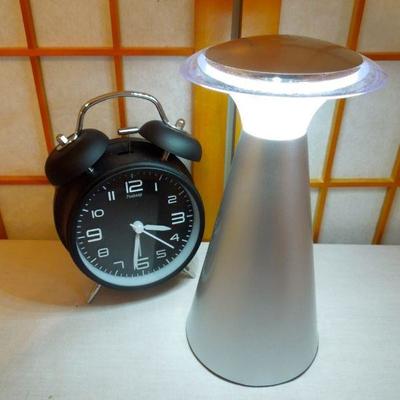 Lot 155: Amazon Kindle in Case, Touch Lamp and Alarm Clock