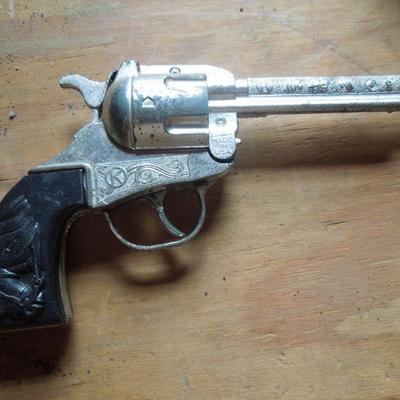 Lot 247: Three 1950's Cowboy Cap Pistols and Adventure Books