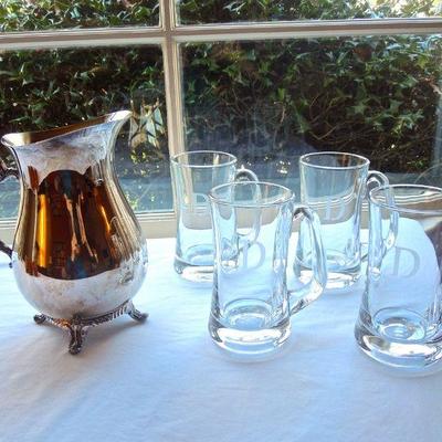 Lot 173: Four Heavy Monogramed Beer Mugs and a Silver Pitcher