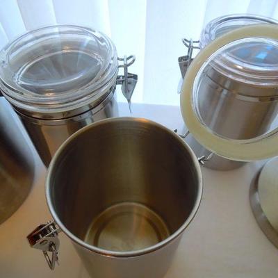 Lot 184: 5 Stainless Canisters and Stainless Towel Dispenser