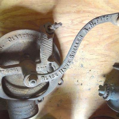 Lot 246: Antique Iron Sheller and Vintage tin Canisters