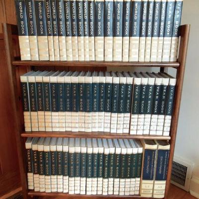 Lot 256: Folding Wooden 3 Shelf Bookcase and Encyclopedias