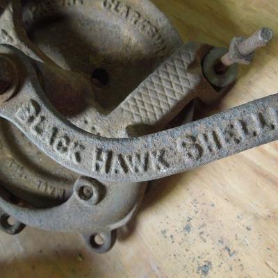 Lot 246: Antique Iron Sheller and Vintage tin Canisters