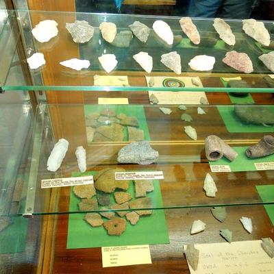 Lot 276: Large NC Cherokee Nation et al Relics and Arrowheads in Glass Case