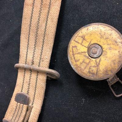 Vintage tape measure and beet diggers belt