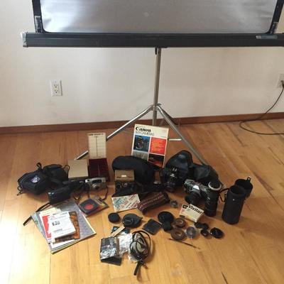 Lot 84 - Vintage Canon and Nikon Cameras, Lens and More