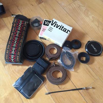 Lot 84 - Vintage Canon and Nikon Cameras, Lens and More