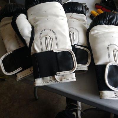 Two sets of boxing gloves
