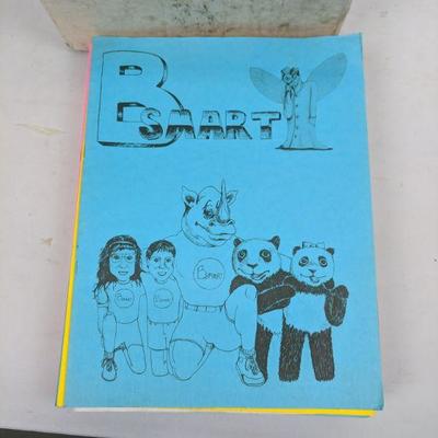 Cream Paper and box of Be Smart Pamphlets