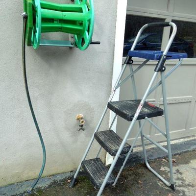 Lot 28: 34in Werner Folding Step Ladder  and Hose Handler Hanging Hose Reel