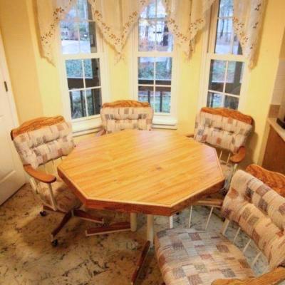 Lot 131: Vintage Embossed Wood Octagonal Kitchen Table and Padded Swivel Chairs