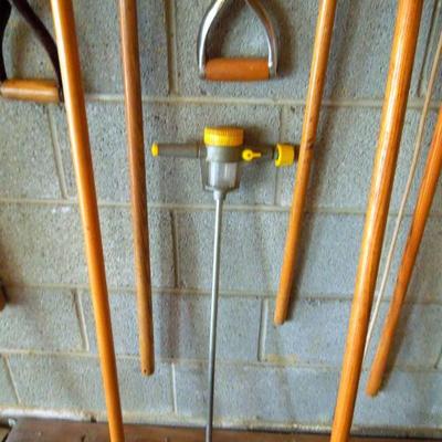 Lot 49: Wall of Quality Wood Handled Garden and Yard Tools