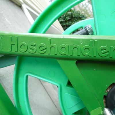 Lot 28: 34in Werner Folding Step Ladder  and Hose Handler Hanging Hose Reel