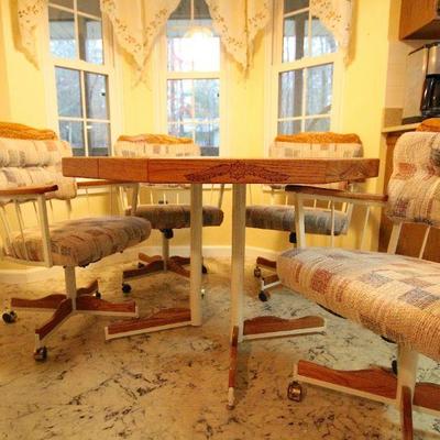 Lot 131: Vintage Embossed Wood Octagonal Kitchen Table and Padded Swivel Chairs
