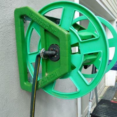 Lot 28: 34in Werner Folding Step Ladder  and Hose Handler Hanging Hose Reel