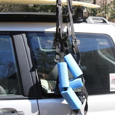 Lot 14: 6' 4" Surfboard by Cosmic Creations with Foam Car Straps