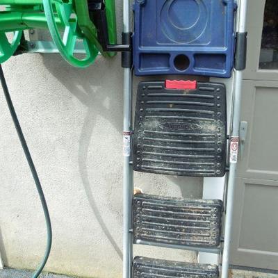 Lot 28: 34in Werner Folding Step Ladder  and Hose Handler Hanging Hose Reel