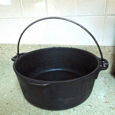Lot 172: Four Sizes Cast Iron Skillets and 5qt. Dutch Oven