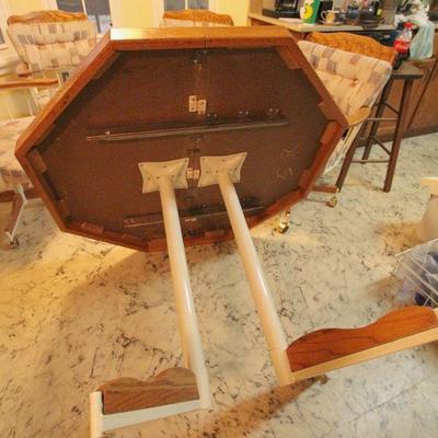 Lot 131: Vintage Embossed Wood Octagonal Kitchen Table and Padded Swivel Chairs