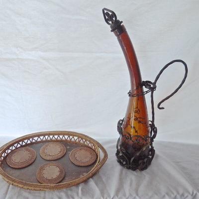 Lot 63: Moroccan Amber Glass Decanter with Iron Stand and Grass Serving Tray