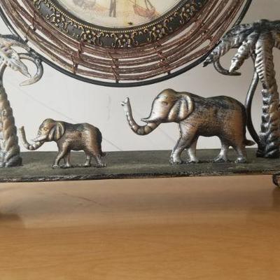 Lot 76 - Tin Desk Cloxk with Elephant 
