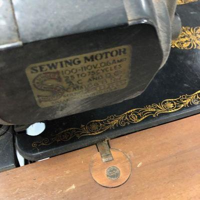 Antique Electric Singer Sewing machine in cabinet 