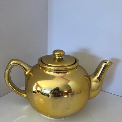 027: Assorted Tea Cups with Saucers and a Tea Pot