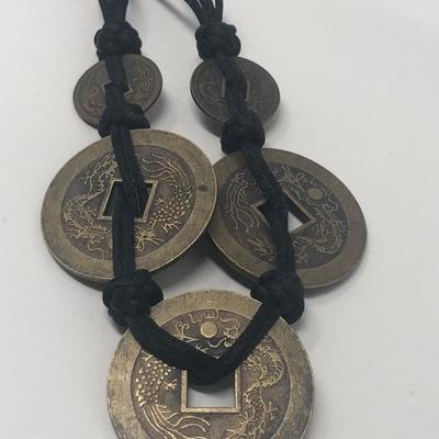 172:  Five Brass Chinese Coin Necklace on Kotted Black Cloth Strand