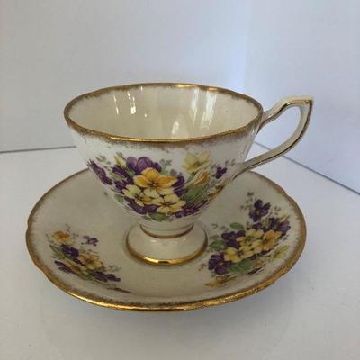 027: Assorted Tea Cups with Saucers and a Tea Pot