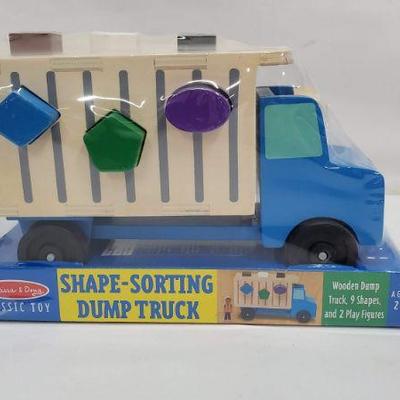 Melissa & Doug Shape-Sorting Dump Truck, 9 Shapes & 2 Play Figures - New
