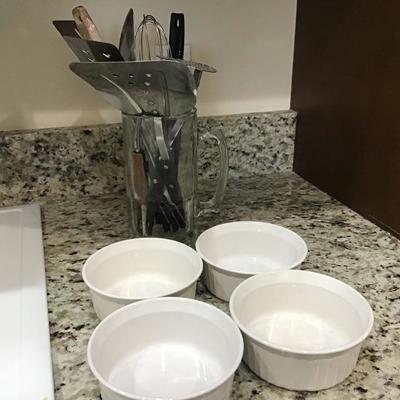 Large glass mug with utensils and 4 Corningware bowls