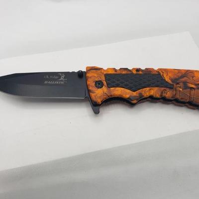 Used orange and black knife