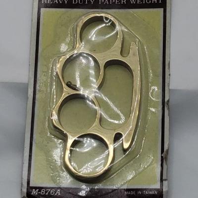 Brass knuckles paper weight