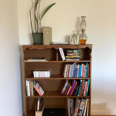 113: Bookshelf with books and plants