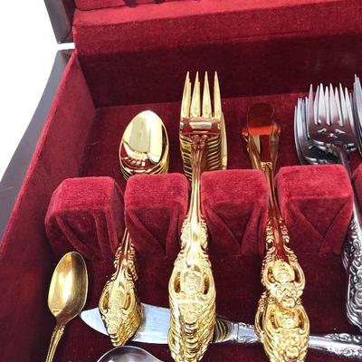 074:  Oneida Gold and Silver Toned Flatware 