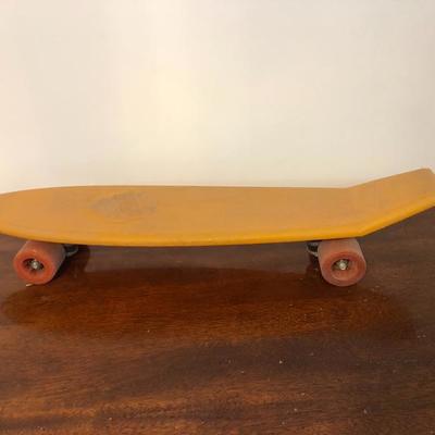 234:  Orange Huffy Hunder Skate Board 24 Action Tail 