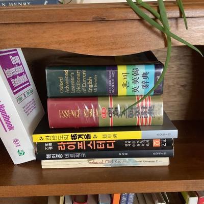 113: Bookshelf with books and plants