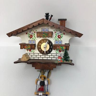 087:  German Wall Clock and Enesco Wood Music Figurine