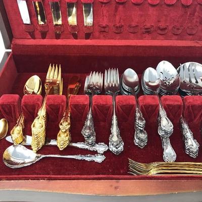 074:  Oneida Gold and Silver Toned Flatware 