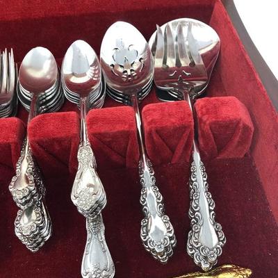 074:  Oneida Gold and Silver Toned Flatware 