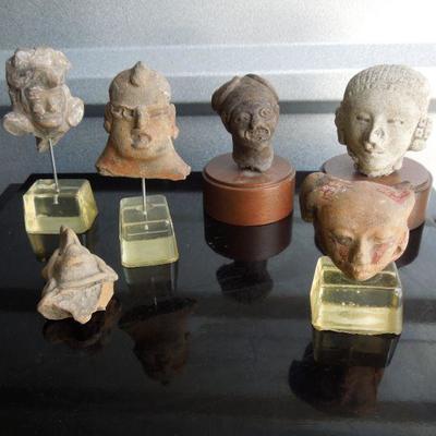 Lot 97: Six Replica Pre-Columbian Clay Heads Mounted on Base