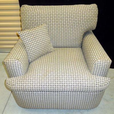 Lot 212: Oversized Upholstered Chair with Rolling Ottoman