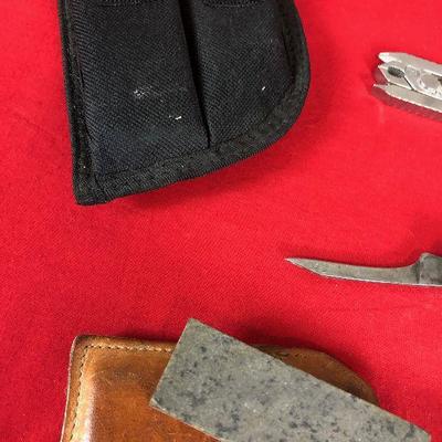 Lot 286 Several pocket knives, wet stone, folding pliers